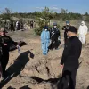 Поліція ексгумувала перші 20 тіл на місці масового поховання в Лимані